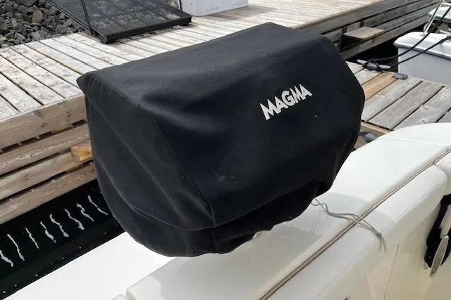  Yacht Photos Pics Covered Magma grill on 2008 Silverton 38 Sport Bridge boat at dock.