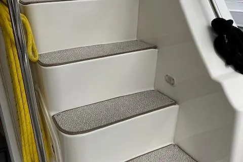  Yacht Photos Pics 2008 Silverton 38 Sport Bridge boat stairs with carpeted steps and yellow rope.