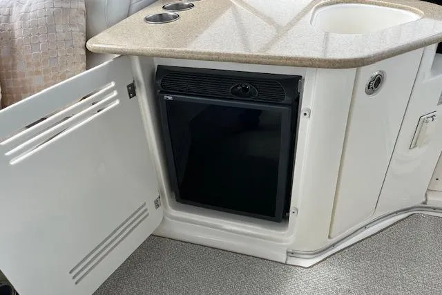  Yacht Photos Pics 2008 Silverton 38 Sport Bridge interior with mini fridge and countertop.