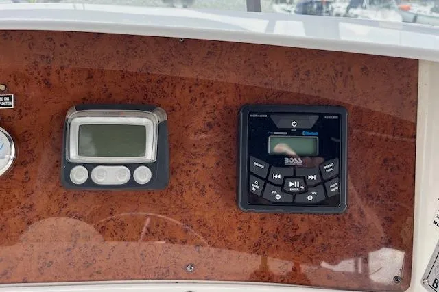  Yacht Photos Pics 2008 Silverton 38 Sport Bridge dashboard with digital controls and audio system.