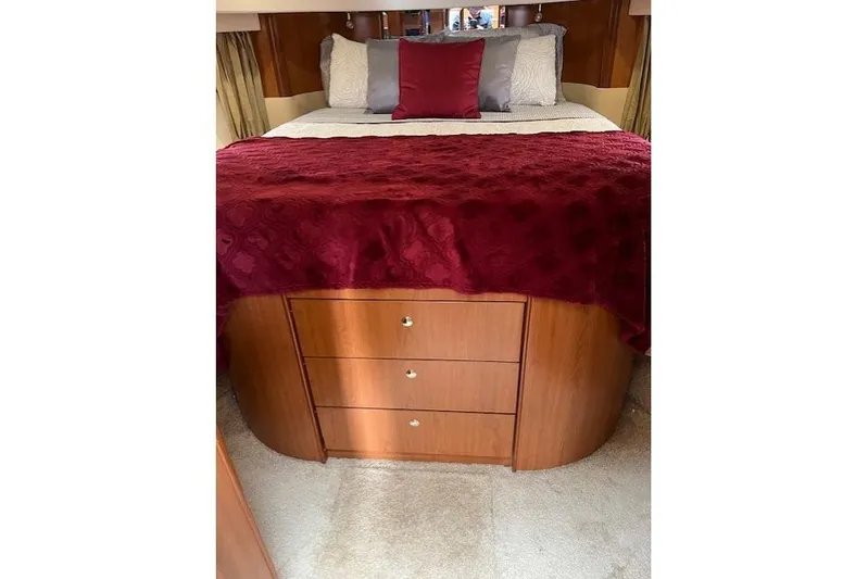  Yacht Photos Pics Luxurious bedroom interior of 2008 Silverton 38 Sport Bridge with elegant bedding and storage.