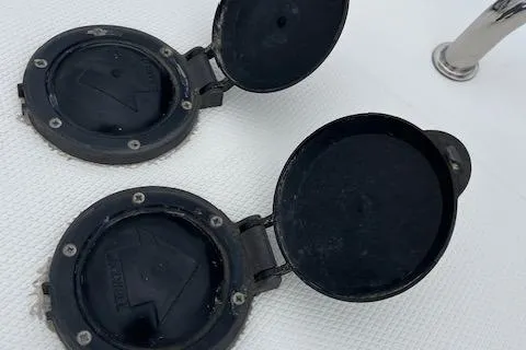  Yacht Photos Pics 2008 Silverton 38 Sport Bridge boat deck fittings with open covers.