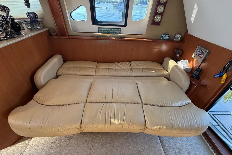  Yacht Photos Pics Luxurious interior of 2008 Silverton 38 Sport Bridge with beige leather seating.