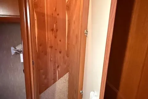  Yacht Photos Pics Interior view of 2008 Silverton 38 Sport Bridge with wooden cabinetry and carpeted flooring.