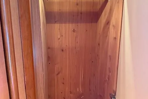  Yacht Photos Pics Wooden interior of 2008 Silverton 38 Sport Bridge yacht closet.