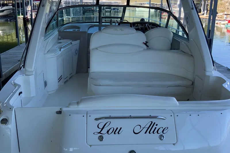 Lou Alice Yacht Photos Pics 2000 Sea Ray Sundancer boat interior with white seating, docked at marina.