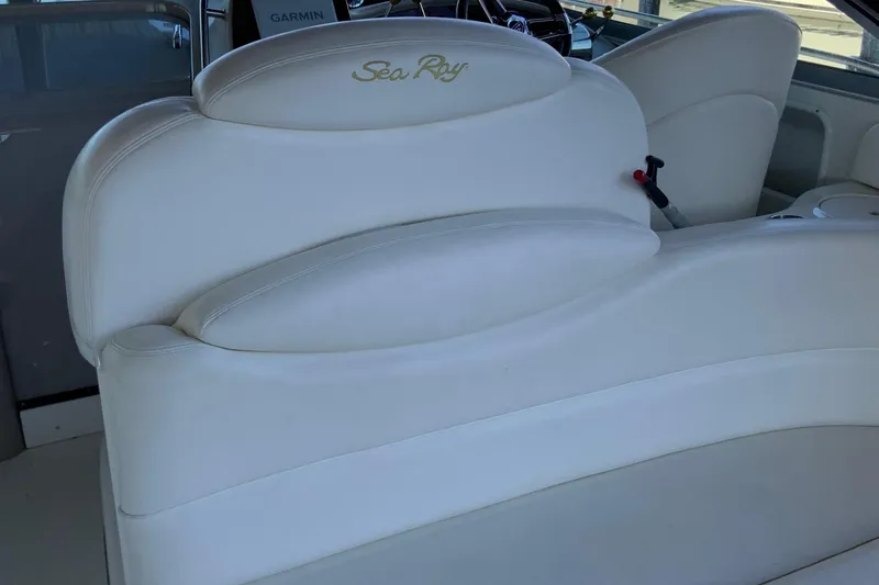 Lou Alice Yacht Photos Pics White leather seating on a 2000 Sea Ray Sundancer boat interior.