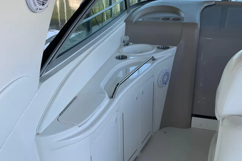 Lou Alice Yacht Photos Pics 2000 Sea Ray Sundancer interior with sink and storage cabinets.