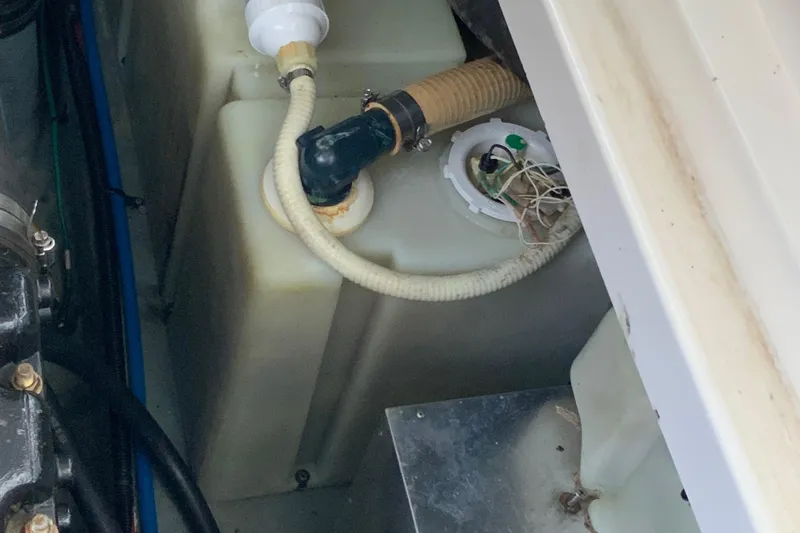 Lou Alice Yacht Photos Pics Engine compartment of 2000 Sea Ray Sundancer boat showing hoses and components.