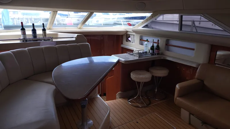 Spectre Yacht Photos Pics Luxurious interior of 2001 Sea Ray 420 Aft Cabin yacht with seating and bar area.