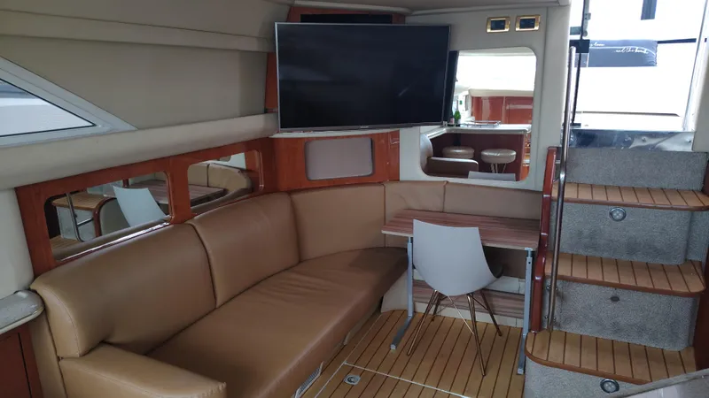 Spectre Yacht Photos Pics Interior of 2001 Sea Ray 420 Aft Cabin with leather seating and modern decor.