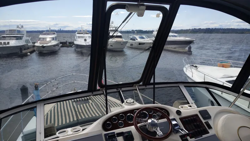 Spectre Yacht Photos Pics Cockpit view of 2001 Sea Ray 420 Aft Cabin yacht docked at marina.