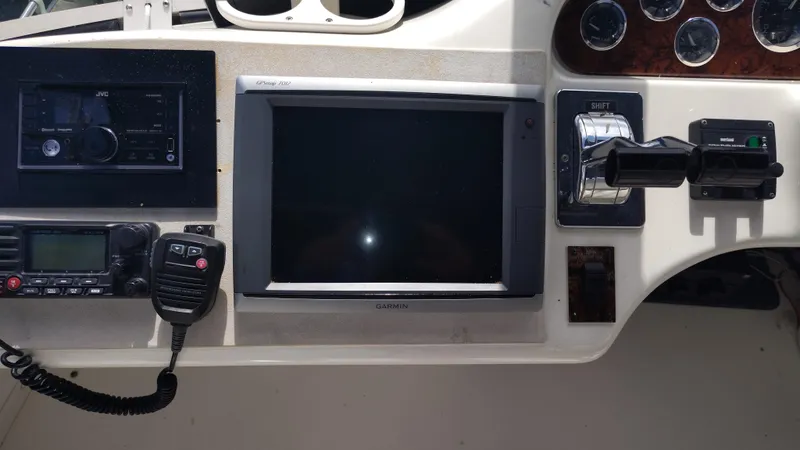 Spectre Yacht Photos Pics Control panel of a 2001 Sea Ray 420 Aft Cabin with navigation and communication equipment.