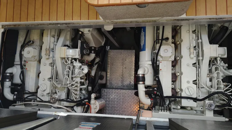 Spectre Yacht Photos Pics Engine room of 2001 Sea Ray 420 Aft Cabin with dual engines and mechanical components.