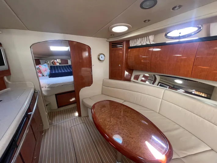  Yacht Photos Pics Interior of 2004 Sea Ray 360 Sundancer yacht with elegant seating and wood finishes.