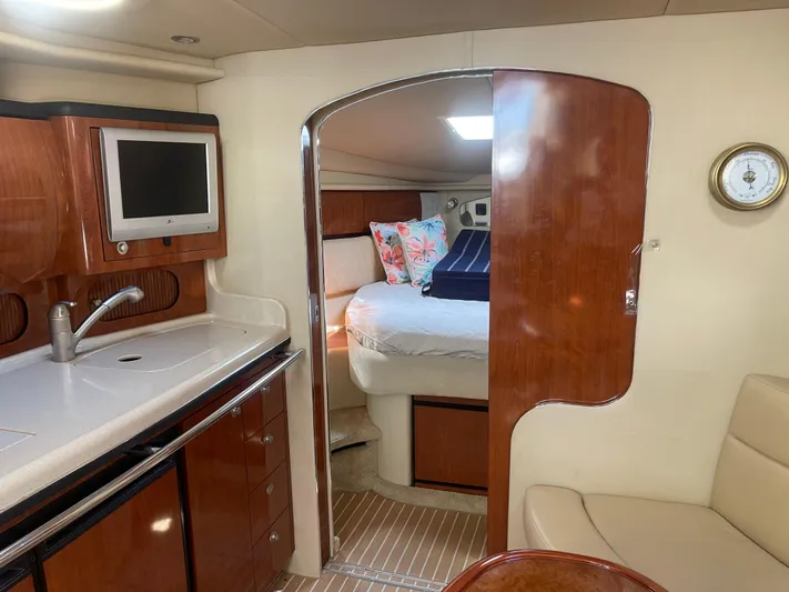  Yacht Photos Pics Interior of 2004 Sea Ray 360 Sundancer yacht with kitchenette and cozy cabin.