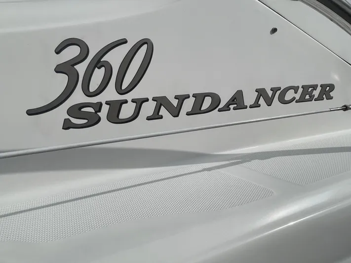  Yacht Photos Pics 2004 Sea Ray 360 Sundancer boat nameplate on white hull.