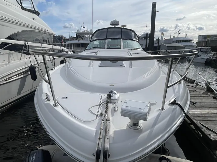  Yacht Photos Pics 2004 Sea Ray 360 Sundancer docked at marina, showcasing sleek design and spacious deck.