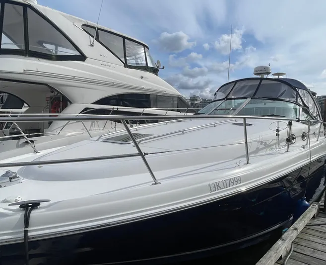  Yacht Photos Pics 2004 Sea Ray 360 Sundancer docked at marina under cloudy sky.