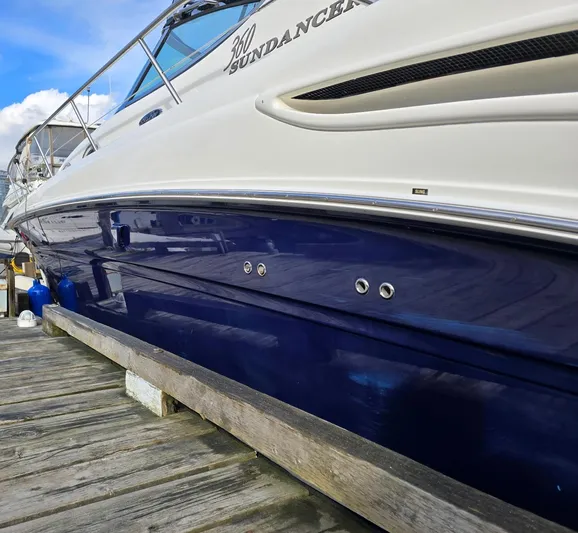 Yacht Photos Pics 2004 Sea Ray 360 Sundancer yacht docked, showcasing sleek blue and white design.