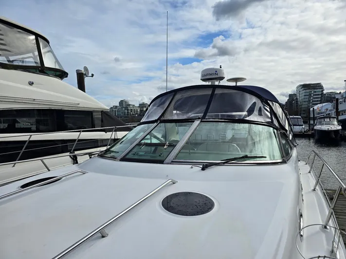  Yacht Photos Pics 2004 Sea Ray 360 Sundancer yacht docked at marina under cloudy sky.