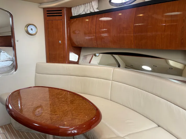  Yacht Photos Pics Luxurious interior of 2004 Sea Ray 360 Sundancer yacht with elegant wood finishes.