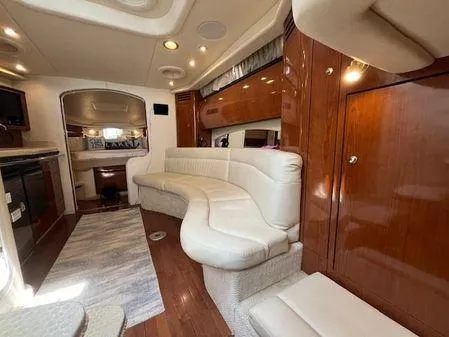  Yacht Photos Pics Luxurious interior of a 2004 Sea Ray 360 Sundancer yacht with plush seating and wood finishes.