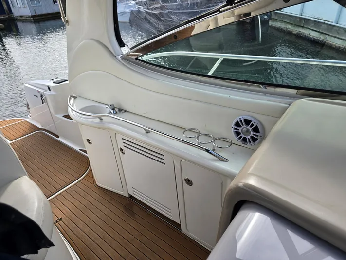  Yacht Photos Pics 2004 Sea Ray 360 Sundancer interior with wood flooring and storage cabinets.