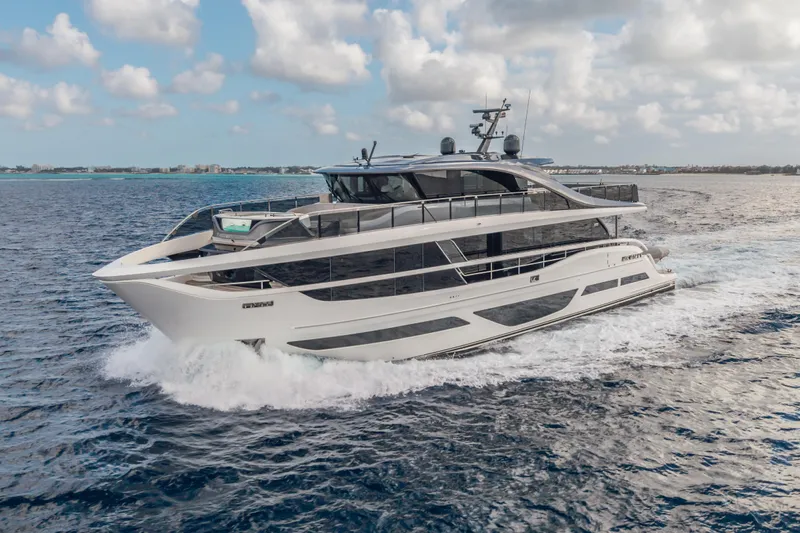 Gemini Yacht Photos Pics Luxurious 2023 Princess X95 yacht cruising on open sea under cloudy sky.