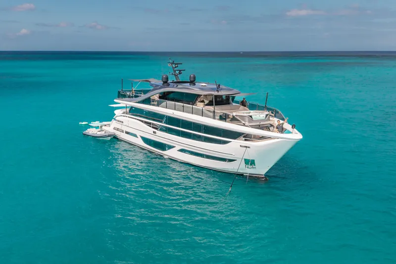 Gemini Yacht Photos Pics Luxury 2023 Princess X95 yacht on turquoise ocean waters.