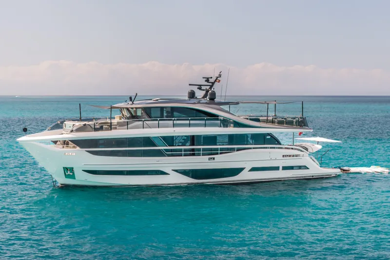 Gemini Yacht Photos Pics 2023 Princess X95 yacht cruising on clear blue ocean waters.