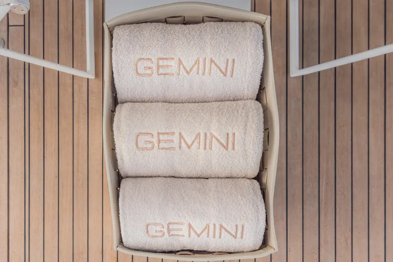 Gemini Yacht Photos Pics Luxurious towels labeled "GEMINI" on Princess X95 yacht deck, 2023 model.