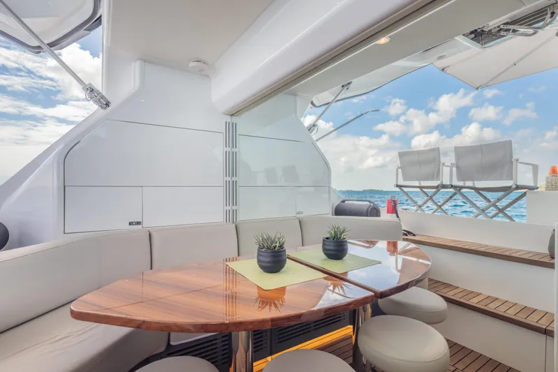 Gemini Yacht Photos Pics Luxurious 2023 Princess X95 yacht interior with elegant seating and ocean view.