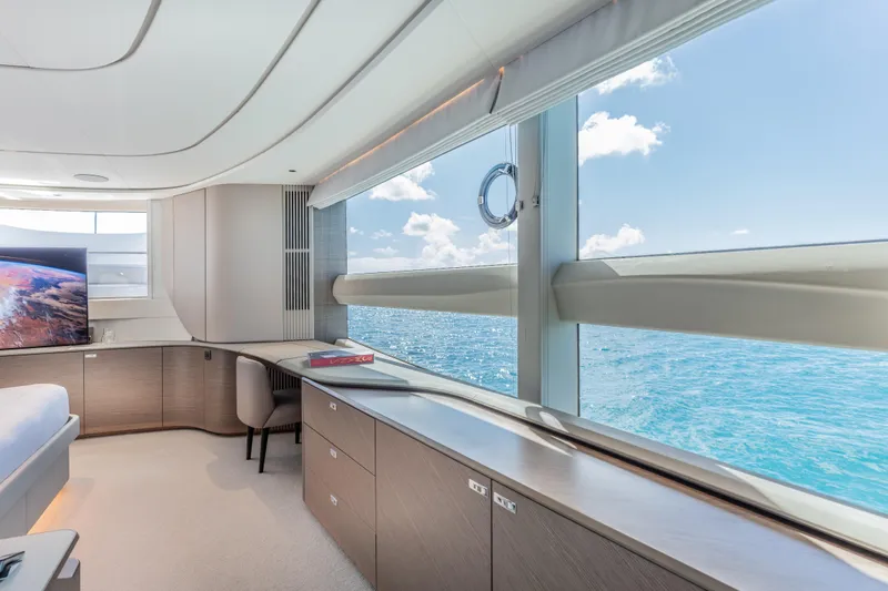 Gemini Yacht Photos Pics Luxurious interior of 2023 Princess X95 yacht with ocean view and modern furnishings.