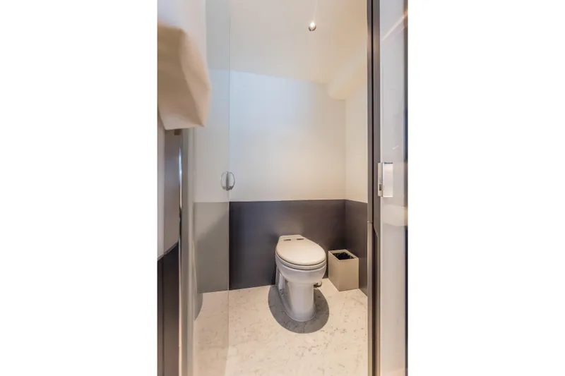 Gemini Yacht Photos Pics Luxury bathroom on 2023 Princess X95 yacht, featuring modern toilet design.