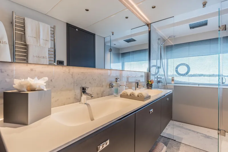 Gemini Yacht Photos Pics Luxurious bathroom on 2023 Princess X95 yacht with modern fixtures and elegant design.