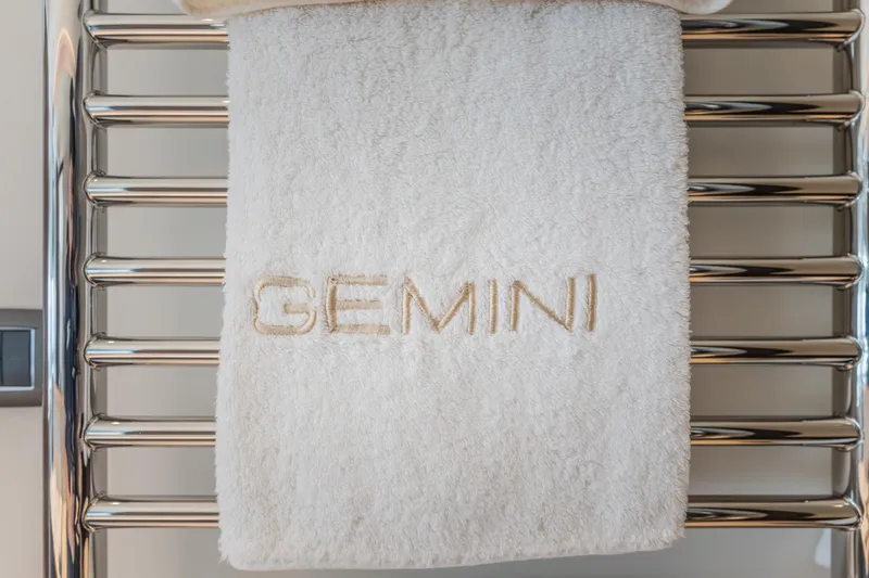 Gemini Yacht Photos Pics White towel with "GEMINI" embroidery on Princess X95 yacht, 2023 model.