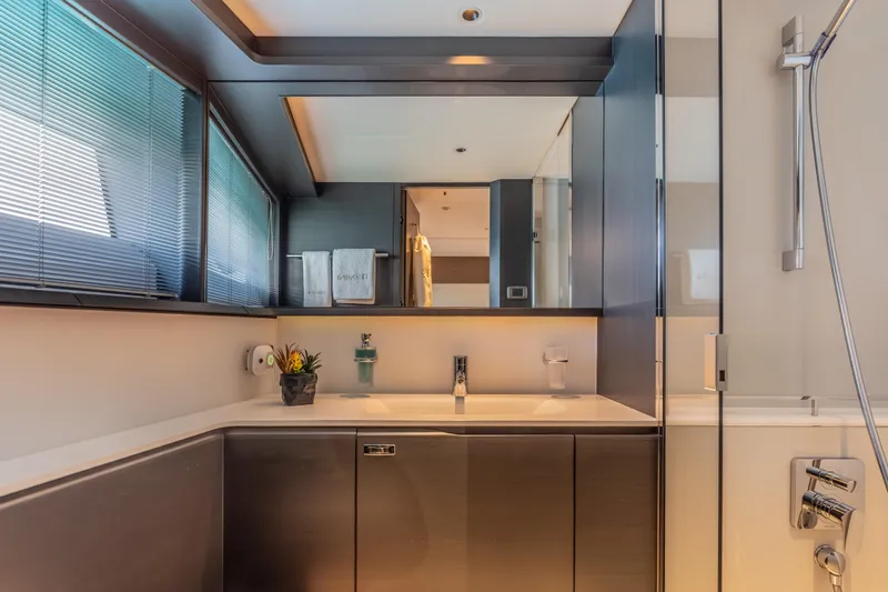 Gemini Yacht Photos Pics Luxurious bathroom interior of 2023 Princess X95 yacht, featuring modern fixtures and elegant design.