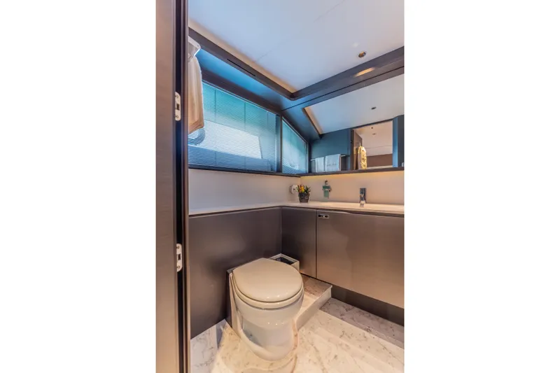 Gemini Yacht Photos Pics Luxurious bathroom in 2023 Princess X95 yacht with modern fixtures and elegant design.