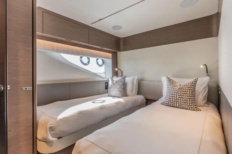 Gemini Yacht Photos Pics Luxurious twin cabin interior of 2023 Princess X95 yacht with modern design and elegant decor.