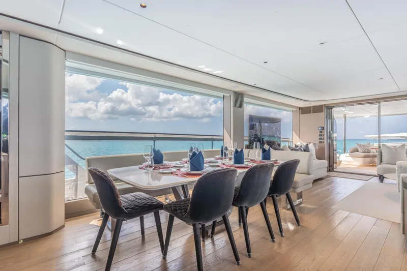 Gemini Yacht Photos Pics Luxurious dining area on 2023 Princess X95 yacht with ocean view.