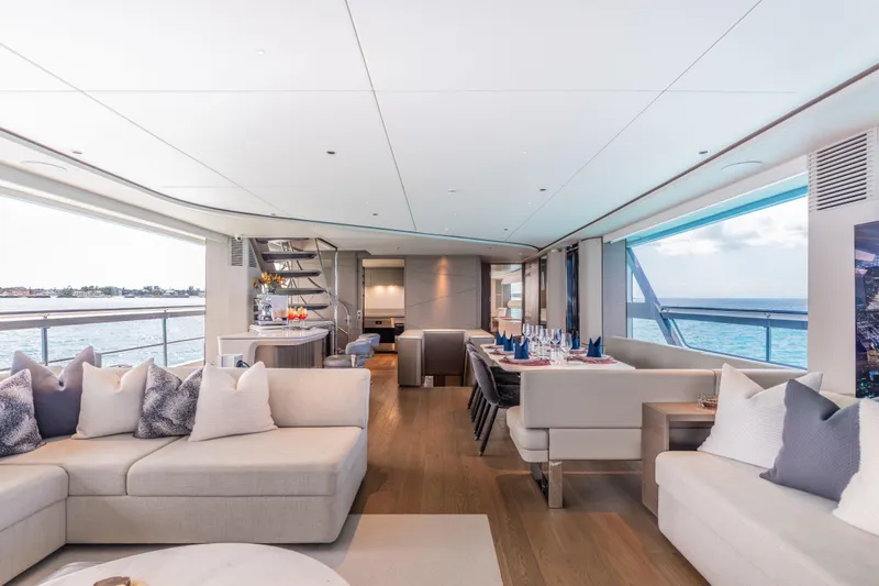 Gemini Yacht Photos Pics Luxurious interior of 2023 Princess X95 yacht with elegant seating and ocean views.