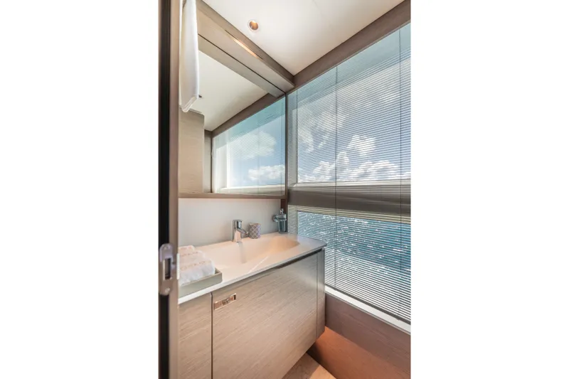 Gemini Yacht Photos Pics Luxurious bathroom interior of 2023 Princess X95 yacht with ocean view.