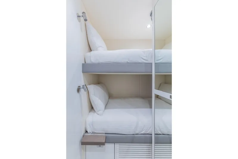 Gemini Yacht Photos Pics 2023 Princess X95 yacht interior with modern bunk beds and sleek design.