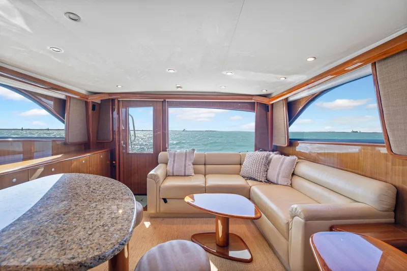  Yacht Photos Pics Luxurious interior of a 2008 Viking Convertible yacht with ocean view and elegant furnishings.