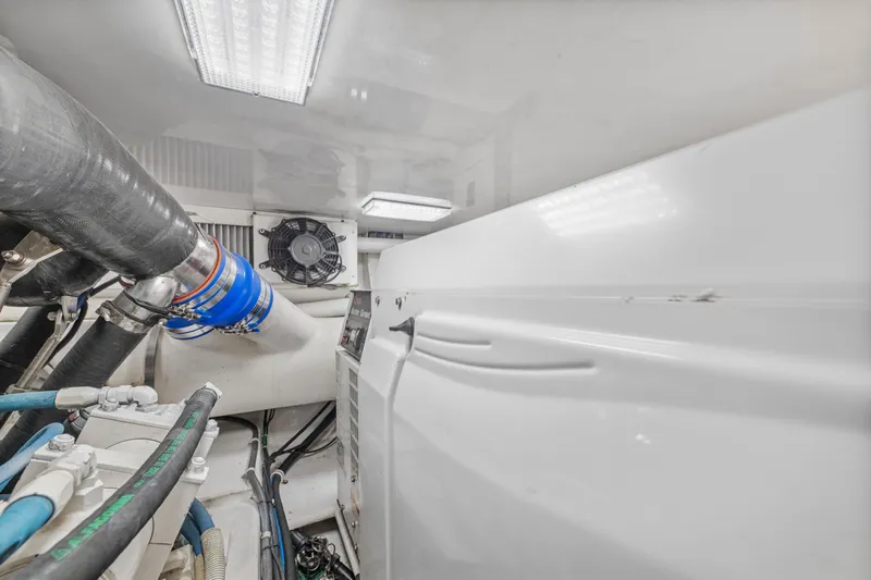  Yacht Photos Pics Engine room of a 2008 Viking Convertible yacht with visible pipes and machinery.