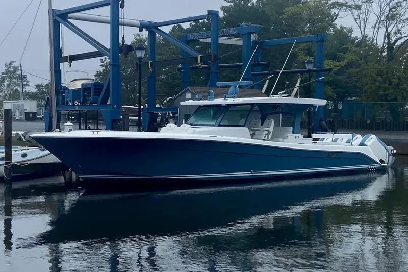  Yacht Photos Pics 2025 HCB 48 Campeon boat docked at marina, sleek blue design.