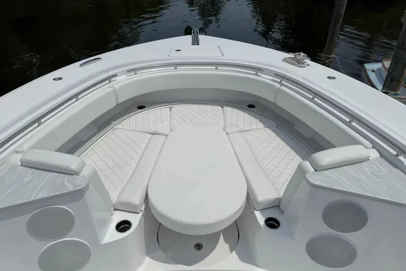  Yacht Photos Pics Luxurious seating area on 2025 HCB 48 Campeon boat, featuring white cushioned seats.