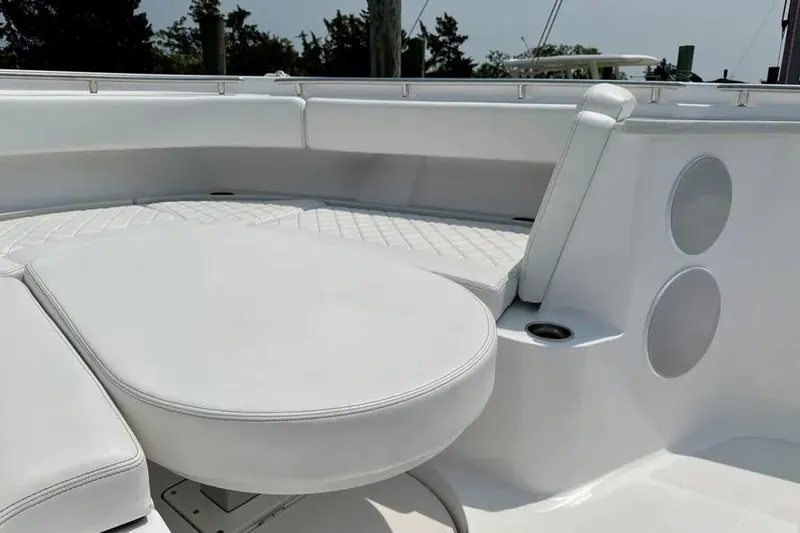  Yacht Photos Pics 2025 HCB 48 Campeon boat interior with white cushioned seating and sleek design.