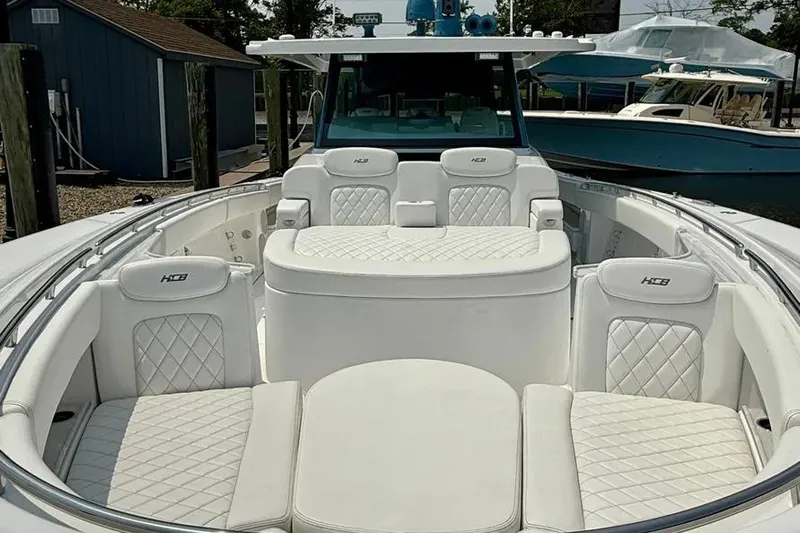  Yacht Photos Pics Luxurious 2025 HCB 48 Campeon boat interior with white quilted seating.